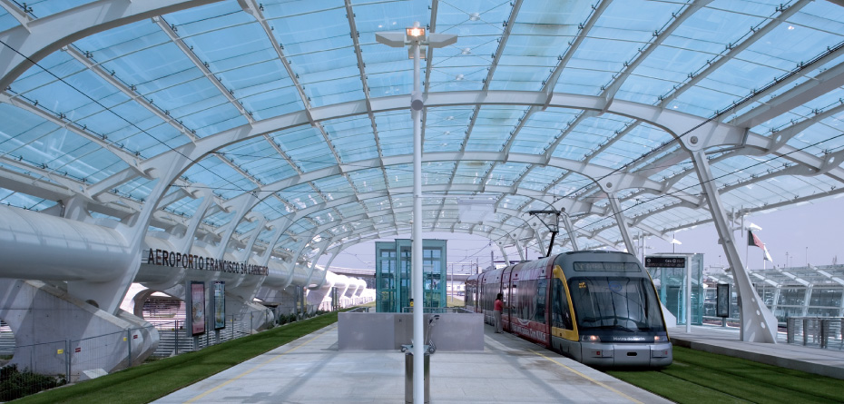 Train on the tracks under a glass dome at Oporto airport station, Porto, Portugal