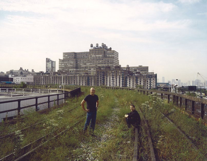 Two men sit on the abandoned tracks that would become the High Line